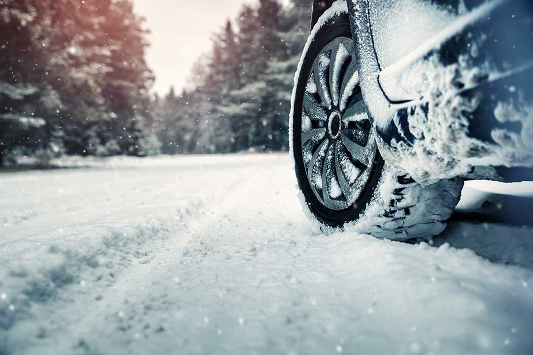 Picture of car driving through snow