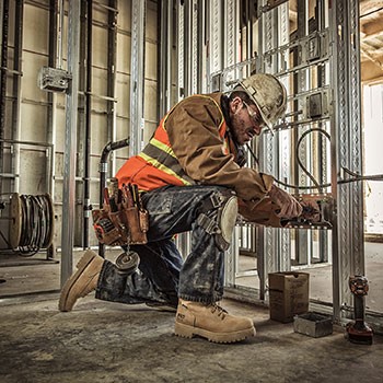 Man kneeling and working