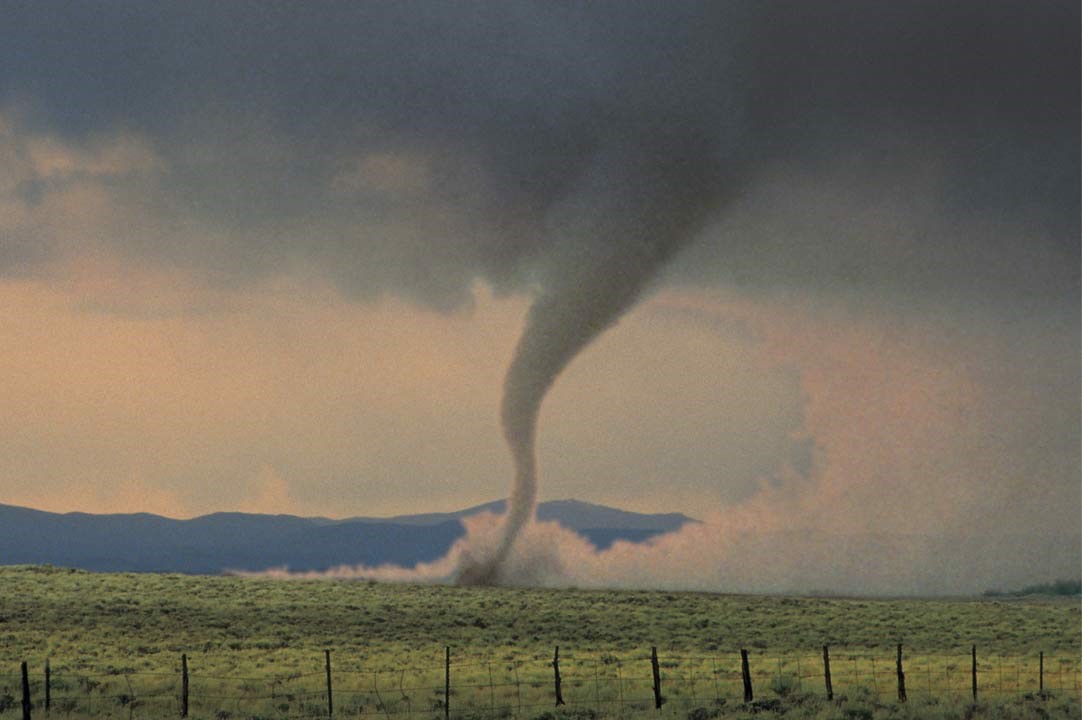 Image of a tornado in a field